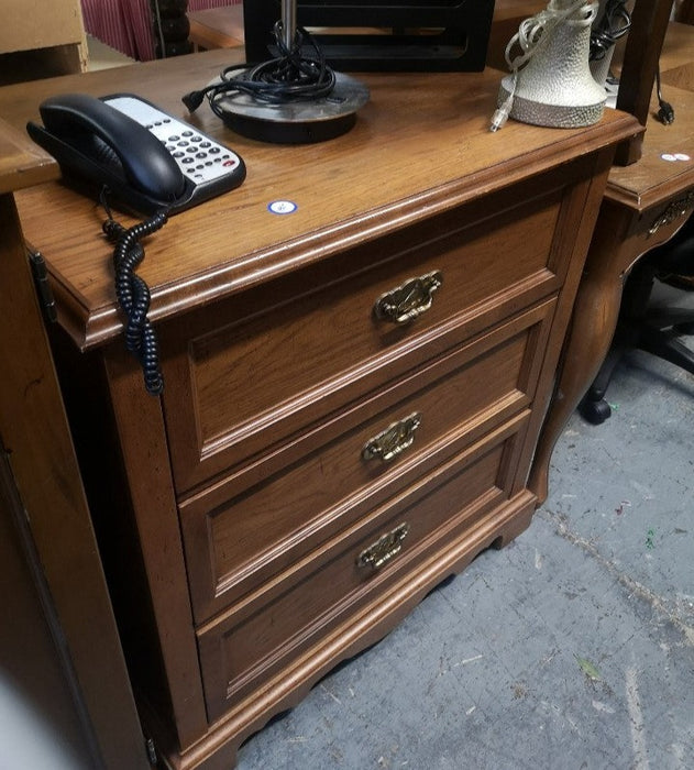 Three drawer dresser with traditional hardware