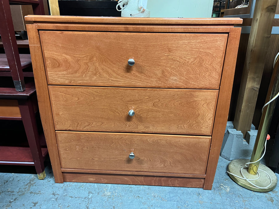 Orange light wood dresser