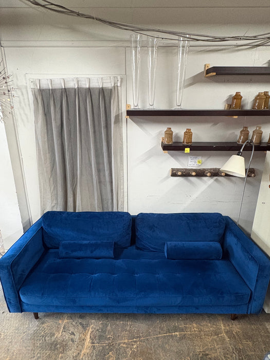 Blue velvet sofa