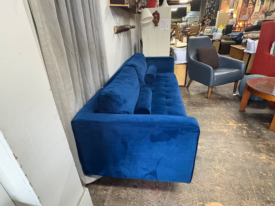 Blue velvet sofa